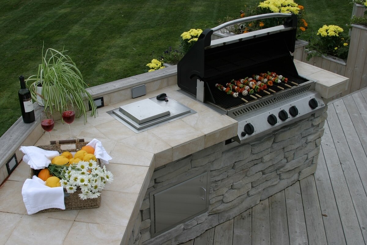 Stone And Tile Outdoor Kitchen On Wood Deck 