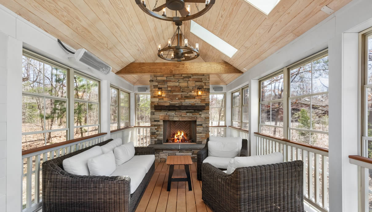 screened in porch with windows and fireplace